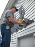 2011 Tom Coulombe finishes installing GFMRRC Train Sign 6-18-11.jpg